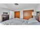 Bedroom with a view of the closets, neutral paint and wood floors at 1433 Ellison Ln, Lakeland, FL 33801