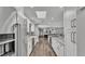 Bright kitchen featuring white cabinets, stainless steel appliances, and an open design with a skylight at 1433 Ellison Ln, Lakeland, FL 33801
