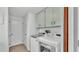 Laundry room with modern washer and dryer units, neutral walls, and plenty of natural light at 1433 Ellison Ln, Lakeland, FL 33801