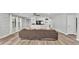 Living room with built-in storage, wood-look flooring, and an inviting neutral color palette at 1433 Ellison Ln, Lakeland, FL 33801
