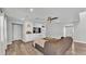 Comfortable living room with built-in storage, wood-look flooring, and an inviting neutral color palette at 1433 Ellison Ln, Lakeland, FL 33801