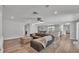 Open-concept living room with modern decor, wood-look flooring, and an inviting and comfortable design at 1433 Ellison Ln, Lakeland, FL 33801