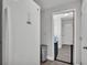 Mud room area featuring a refrigerator, a trash can, and a dog gate at 1433 Ellison Ln, Lakeland, FL 33801