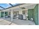 Covered patio with outdoor cooking space and garden wall at 1433 Ellison Ln, Lakeland, FL 33801