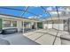 An open-air patio with space for hot tub and entertaining, with convenient access to both the home and backyard at 1433 Ellison Ln, Lakeland, FL 33801