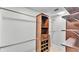 Organized walk-in closet featuring custom wood shelving and ample hanging space at 1433 Ellison Ln, Lakeland, FL 33801