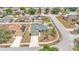 Aerial view of the property showcasing the lawn, landscaping, and neighborhood at 1520 Caroline Ct, Bartow, FL 33830