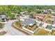 Bright aerial view of a home featuring a fenced yard, shed, screened in porch and mature landscaping at 1520 Caroline Ct, Bartow, FL 33830
