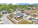 Bright aerial view of a home featuring a fenced yard, shed, screened in porch and mature landscaping at 1520 Caroline Ct, Bartow, FL 33830