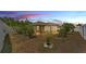 Wide backyard view at dusk with white fence and view of screened in porch at 1520 Caroline Ct, Bartow, FL 33830