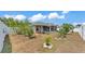 Wide backyard view with white fence and view of screened in porch at 1520 Caroline Ct, Bartow, FL 33830