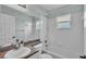 Bright bathroom features a shower-tub combination and vanity with granite countertop at 1520 Caroline Ct, Bartow, FL 33830