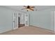 Bedroom featuring neutral walls, carpet flooring, and french doors opening to the rest of the home at 1520 Caroline Ct, Bartow, FL 33830