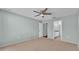 Neutral bedroom with a carpeted floor, window with blinds, and ceiling fan at 1520 Caroline Ct, Bartow, FL 33830