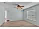 This bedroom includes neutral walls, carpeted floor, ceiling fan and a window with blinds at 1520 Caroline Ct, Bartow, FL 33830