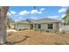 Single-story home showcasing stone column accents, and a well-maintained lawn at 1520 Caroline Ct, Bartow, FL 33830