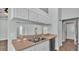 Kitchen featuring stainless steel sink, modern countertops, and access to other parts of the home at 1520 Caroline Ct, Bartow, FL 33830