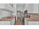 A well-lit kitchen features stainless steel appliances, modern countertops, and ample cabinet space at 1520 Caroline Ct, Bartow, FL 33830