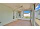 Screened patio featuring tiled floor and ceiling fan, great for outdoor enjoyment at 1520 Caroline Ct, Bartow, FL 33830