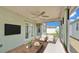 Enclosed sun room featuring comfortable seating, a ceiling fan, and sliding windows for relaxation and enjoyment at 1520 Caroline Ct, Bartow, FL 33830