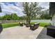 Relaxing backyard with patio furniture set on a concrete patio and a neatly fenced yard at 1536 Del Crest Pl, Lakeland, FL 33803