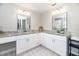 Bathroom vanity area with dual mirrors, decorative floors, and granite countertops at 1536 Del Crest Pl, Lakeland, FL 33803