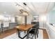 Dining area with modern lighting fixture and a view to the open floor plan at 1536 Del Crest Pl, Lakeland, FL 33803