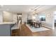 Open-concept dining area with modern light fixture and seamless flow into the kitchen at 1536 Del Crest Pl, Lakeland, FL 33803