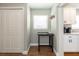 Hallway nook with a window, small table, and access to a closet and the kitchen at 1536 Del Crest Pl, Lakeland, FL 33803