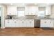 Updated kitchen featuring white cabinets, stainless steel appliances, and ample counter space at 1536 Del Crest Pl, Lakeland, FL 33803