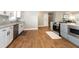 Well-lit kitchen with granite countertops, modern stainless steel appliances and wood flooring at 1536 Del Crest Pl, Lakeland, FL 33803