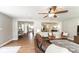 Spacious living room with view of kitchen, dining area and wood-look tile floors at 1536 Del Crest Pl, Lakeland, FL 33803