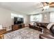 Inviting living room featuring a television and a ceiling fan at 1536 Del Crest Pl, Lakeland, FL 33803