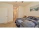 Inviting bedroom features a ceiling fan, a window and comfortable furnishings at 1620 Linz Ct, Winter Haven, FL 33884
