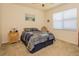 Cozy bedroom with a ceiling fan, window and comfortable furnishings at 1620 Linz Ct, Winter Haven, FL 33884
