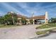 Elegant gated community entrance with lush landscaping, creating a welcoming first impression at 1620 Linz Ct, Winter Haven, FL 33884