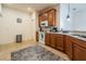 Spacious kitchen featuring tile flooring, stainless steel appliances, and wooden cabinetry at 1620 Linz Ct, Winter Haven, FL 33884