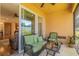 Cozy screened patio with comfortable seating, ceiling fan and sliding glass doors at 1620 Linz Ct, Winter Haven, FL 33884