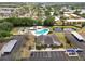 Aerial view of community amenities including pool, shuffleboard, clubhouse, and ample parking at 2025 Sylvester Rd # E2, Lakeland, FL 33803