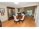Warm dining area featuring a wooden table, chairs, and access to a living room with a fireplace at 2025 Sylvester Rd # E2, Lakeland, FL 33803