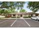 Well-maintained townhome with lush landscaping, ample parking, and a neatly kept facade at 2025 Sylvester Rd # E2, Lakeland, FL 33803