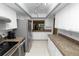 Bright kitchen with stainless steel appliances, track lighting, and white cabinetry at 2025 Sylvester Rd # E2, Lakeland, FL 33803