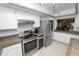 Modern kitchen featuring stainless steel appliances and a view into the living area at 2025 Sylvester Rd # E2, Lakeland, FL 33803