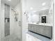 Modern bathroom with a glass-enclosed shower, double vanity, and stylish tile accents at 203 N Sweetwater Blvd, Longwood, FL 32779