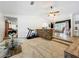 Open-concept living room and dining area separated by a brick accent wall, bright and spacious at 203 N Sweetwater Blvd, Longwood, FL 32779