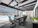 Enclosed pool area with dining table, ceiling fans, and access to the indoor bar area for elegant entertainment at 203 N Sweetwater Blvd, Longwood, FL 32779
