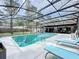 Enclosed swimming pool with lounge chairs, backyard views, and access to the covered patio dining and bar area at 203 N Sweetwater Blvd, Longwood, FL 32779