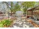 A backyard featuring a storage shed and workspace providing practical storage and project space in the home's outdoor area at 209 S Hydrangea Ave, Polk City, FL 33868
