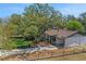 A classic home boasts a manicured lawn and an American flag, creating a welcoming and patriotic ambiance at 209 S Hydrangea Ave, Polk City, FL 33868