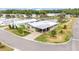 Beautiful aerial view of home near a pond, featuring well-maintained landscaping and a covered carport at 2101 Cypress Cross Dr, Lakeland, FL 33810